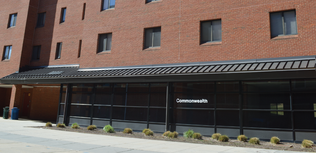 Front entrance of Commonwealth Hall at George Mason University showing main doors and building facade