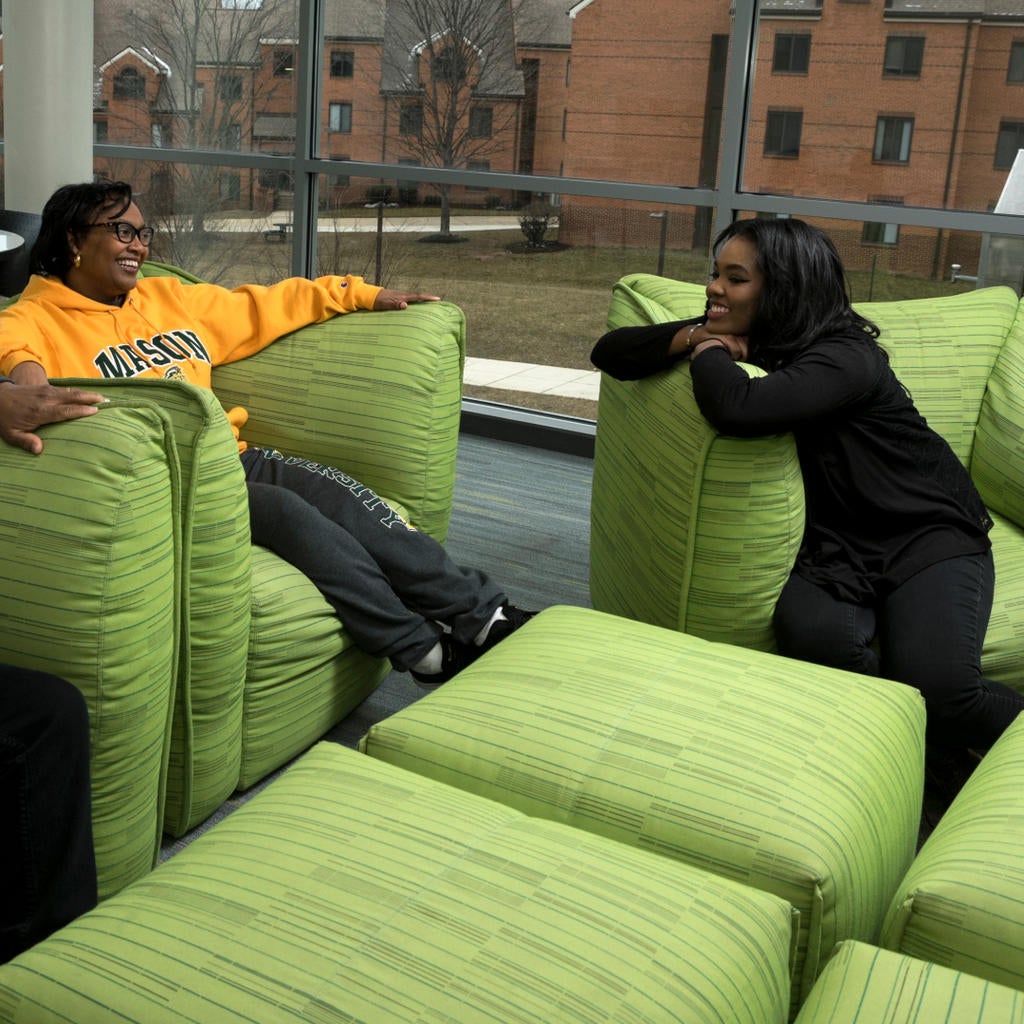 Two students on residence hall chairs
