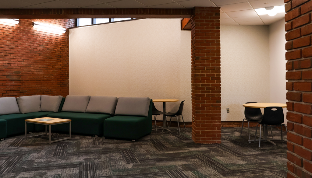 Multipurpose lounge space in Dominion Hall with seating and open floor area