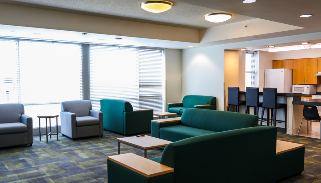 Kitchen and communal space in Eastern Shore Hall with seating, tables, and shared amenities