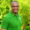 Derrick McReynolds in a green mason polo smiling