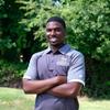 Sheaffeel Gedeon in Gray Mason Polo, Arms crossed Smiling